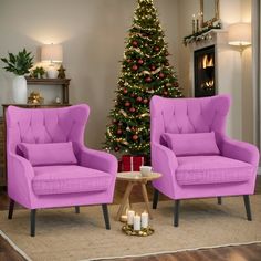 two purple chairs in front of a christmas tree with candles on the floor and a small table