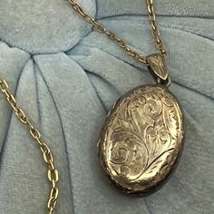 Beautiful Vintage Gold Over Sterling Engraved Or Etched Locket With 1/20 12 Kgf Chain Link Necklace: Carry A Favorite Photo, Note Or Lock Of Hair In This Lovely Vintage Locket! - Etched Floral Design On One Side And Mekhala, Goddess Of Lighting, On The Other Side - Chain Link Necklace Marked '1/20 12 Kgf' (Gold Filled) On The Clasp - Double Locket Marked "Siam Sterling' On Both Sides - Spring Ring Clasp - Circa: Most-Likely Pre-1939 But Could Be As Late As The 1950's, 1960's Or 1980's (Siam Beca Golden Locket Necklace, Antique Lockets Gold, Elegant Oval Link Locket Necklace, Silver Locket Necklace For Formal Occasions, Silver Heirloom Oval Necklace, Formal Engraved Locket Necklace, Elegant Silver Locket Necklace For Formal Occasions, Heirloom Oval Etched Necklace, Classic Antique Silver Oval Necklace