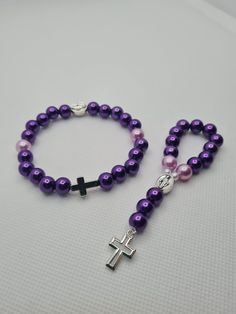 Matching set of handmade pocket rosary and bracelet  ☆ Glossy dark and light purple pearl beads ☆ Silver crosses and Blessed Mother charm Handmade in Scotland, Little Prayers, prayer beads are perfect for those little moments throughout your day. Through your hard times or times you want to give your thanks these beads will be the perfect tool for your prayers. Little Prayers are hand made one by one with love and hope that they will bring you comfort and happiness. Handmade Adjustable Purple Rosary, Purple Beaded Rosary As Gift, Handmade Spiritual Purple Rosary Bracelet, Adjustable Purple Rosary Bracelet, Purple Rosary With 8mm Round Beads, Purple Rosary With 8mm Beads, Adjustable Purple Spiritual Rosary Bracelet, Adjustable Purple Rosary Bracelet With 8mm Beads, Pocket Rosary