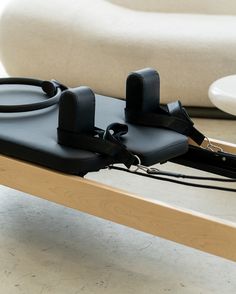 a table that has some kind of device on top of it with cords attached to it