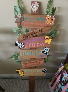 a wooden sign that has animals on it