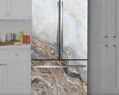 a marbled refrigerator freezer in a kitchen