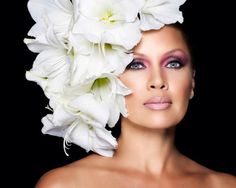 a woman with white flowers on her head