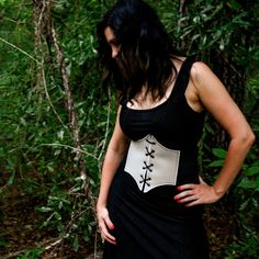 These corsets are the perfect costume accessory for any Renaissance, Medieval, Fairy, Elvish, and many more cosplay outfits.  These corsets are great quality with embroidered edges, metal eyelets, and leather ties.  They have a very comfortable fit made from vinyl leather and the elastic straps will contour to your body and snap in the back.   FAUX LEATHER COLOR OPTIONS: 14 Colors available ELASTIC COLOR: Elastic will be BLACK for all corset belts. SIZE OPTIONS: Recommended for Kids & Youth X-Small: 23" - 27" length Small: 26" - 32" length Recommended for Adult  Medium: 32" - 36" length Large: 36" - 42" length X-Large: 40" - 46" length Punk Style Corset For Cosplay Events, Black Medieval Underbust Corset Belt, Black Steampunk Corset For Larp, Punk Fitted Corset For Fantasy Events, Punk Underbust Corset For Fantasy Events, Punk Corset For Halloween Larp, Steampunk Overbust Corset Belt For Halloween, Fantasy Overbust Corset Belt For Larp, Gothic Corset Belt For Costume Party