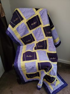 This Crown Royal quilt/ blanket is made from both woven fabric & crown royal bags that are cut into the desired shape & backed with medium weight interfacing to reduce stretching 🐺 | A simple but beautiful coordinating fabric is used to show case the bag color & shape on each throw 🛍️ | Each blanket is then backed with either plush white minky or a plush super thick fleece fabric to keep each throw extra soft 🍦| Anyone of these super soft blankets would be a perfect gift for a loved one or to How To Make A Quilt Out Of Crown Royal Bags, Crown Royal Bag Quilt Pattern, Crown Royal Quilts, Crown Royal Quilt, Crown Royal Bags, Fabric Crown, Super Soft Blanket, Curling Ribbon, Show Case