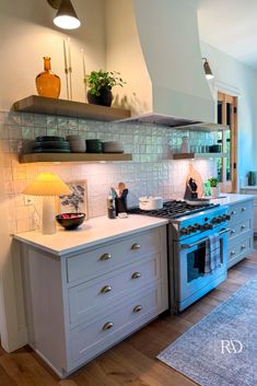 a kitchen with an oven, sink and counter tops in it's center island