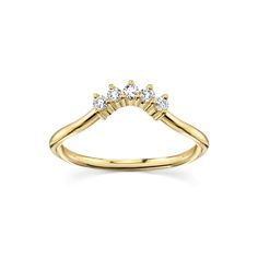 a yellow gold ring with three diamonds