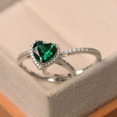 Luxury Heart Cut Emerald Ring For Anniversary, Luxury Heart Cut Emerald Ring For Formal Occasions, Green Fine Jewelry Heart Ring For Wedding, Green Heart Cut Rings For Wedding, Green Heart Cut Wedding Rings, Heart-shaped Emerald Rings For Wedding, Elegant Green Sterling Silver Heart Ring, Elegant Emerald Heart Cut Rings, Elegant Green Heart Sterling Silver Ring