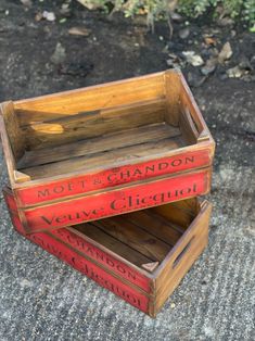 two wooden crates sitting on top of a sidewalk