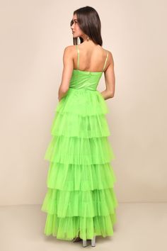 Treat any event like your own personal fashion show when you're wearing a show-stopping look like the Lulus Rule the Runway Lime Green Tulle Bustier Tiered Maxi Dress! This stunning dress is composed of sheer mesh tulle (atop a stretch knit lining) that shapes an alluring bustier-inspired bodice with seamed cups and supportive boning, a sweetheart neckline, and adjustable spaghetti straps. The high, fitted waist tops an A-line maxi skirt, adorned with fluffy tiers of tulle that are sure to make Green Fitted Corset Dress For Gala, Fitted Green Corset Dress For Gala, Fitted Tiered Gala Gown, Fitted Tiered Gown For Gala, Spring Party Gown With Spaghetti Straps, Spring Gala Evening Dress With Corset Back, Green Evening Dress With Boned Bodice For Prom, Fitted Tiered Prom Dress, Fitted Tiered Evening Gown