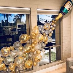 a living room filled with furniture and balloons