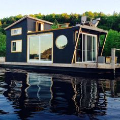 a houseboat floating on top of a body of water