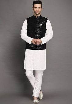 Faux Georgette Kurta in White.This Readymade attire is Enhanced with Buttons, Resham and Sequins Work. Crafted in Chinese Collar Neck and Full SleeveAvailable with Cotton Pant in White and a Velvet Nehru Jacket in BlackDo note: Brooch and Footwear shown in the image is for presentation purposes only. Half to one inch may vary in measurement. (Slight variation in actual color vs. image is possible)  We sell all kinds of menswear. Mens Kurta | Mens Kurta Pajama | Mens Sherwani | Mens Sherwani Sets Traditional Black Outerwear With Chikankari Embroidery, Festive White Outerwear With Chikankari Embroidery, White Festive Outerwear For Fall, Fitted White Sets With Embroidered Sleeves, Traditional Black Nehru Jacket With Stand Collar, Traditional Black Outerwear With Floral Embroidery, Black Festive Set With Embroidered Sleeves, Festive Black Set With Embroidered Sleeves, Black Sets With Embroidered Sleeves For Festive Occasions