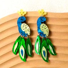 Peacock Acrylic Dangle Post Fashion Jewelry Earrings Eye-Catching Design: Peacock Shaped Earrings With Acrylic Panel And Dangle Tail Feathers, Perfect For Adding A Pop Of Color To Any Outfit Lightweight And Comfortable To Wear All Day Cute & Adorable Cat Friendly, Non-Smoking Home Bohemian Green Earrings With Peacock Design, Green Peacock Design Drop Earrings, Tail Feathers, Acrylic Panels, Cat Friendly, Fashion Jewelry Earrings, Earrings Color, Pop Of Color, Cute Cats