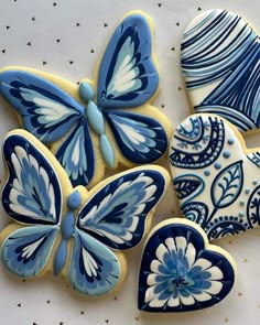 decorated cookies with blue and white butterflies on them