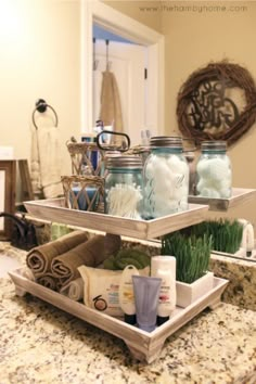 two trays filled with items on top of a counter in front of a mirror