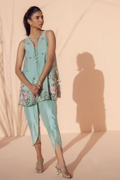 A soft baby blue cotton net front-open kurta with our signature floral embroidery is a fresh addition for the summer season. Paired with our matching raw silk tulip shalwar. Spring Designer Wear Cotton Silk Dress, Spring Kurta With Floral Embroidery In Raw Silk, Spring Cotton Silk Kurta With Resham Embroidery, Spring Designer Cotton Silk Kurta, Spring Raw Silk Kurta With Floral Embroidery, Spring Cotton Silk Kurta With Chikankari Embroidery, Silk Kurta With Floral Embroidery For Spring, Spring Silk Kurta With Floral Embroidery, Embroidered Cotton Silk Kurta For Summer