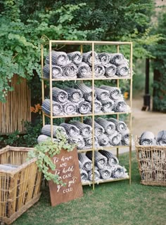 an outdoor display with baskets and blankets