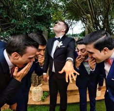 a group of men in suits standing next to each other