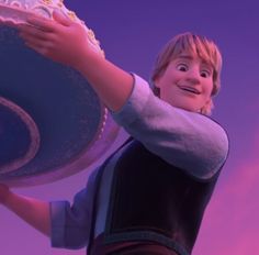 a man holding a cake in front of a purple and blue background with the words frozen princess on it