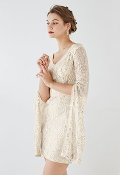 Everything about this effortless cocktail dress is dreamy. From its allover captivating sequins to its feminine v-neckline and eye-catching cape sleeves, it's a must-have party style to brighten up the day or night.      V-neckline  Sequins embellished  Cape sleeves  Unmovable padded cups  Concealed back zip closure  Lined  100% Polyester  Hand wash cold    size & fit      CM   IN                     Size         Length         Bust         Waist         Shoulder  Hip                   XS Sleeve Cape Dress, Sequin Cape, Off White Dress, Led Dress, Fashion Buyer, Cape Sleeves, Cape Dress, Party Style, Indie Design