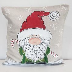 a christmas pillow with a santa clause on it