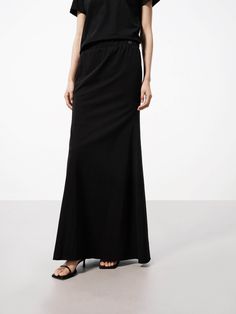 MO&Co. Women's Distressed Jersey Maxi Skirt Crafted from a soft cotton blend with just the right amount of stretch, this maxi skirt feels as good as it looks. The inclusive design makes it a must-have addition to any wardrobe. It has an elasticated waistband that provides a flexible and forgiving fit, and distressed details add a trendy, lived-in look to the skirt, giving it a casual and relaxed vibe. Features : - Inclusive maxi A-line silhouette- Elasticated waist, distressed details- Stretchy Inclusive Design, Knit Midi Skirt, Black Midi Skirt, Knit Midi, Black Knit, Must Haves, Maxi Skirt, Midi Skirt, Cotton Blend