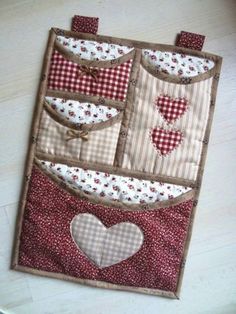 an applique on the back of a purse with hearts and gingham