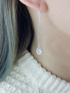 "A pair 925 Sterling Silver dainty long dangling CZ tear drop threader Earrings.  Clear CZ round stone sandwich between 2 teardrops. Large in the front, small teardrop on the back. 925 stamped on the pin. With box chain. A pier silver earrings that is good gift for girl friend, Gift for wife, or a nice gift for mom. It adds a touch of femininity to any outfit. Easy to wear. Simply slide them through your ear and let the chain dangle from behind. The stopper will let them rests on your ear lobe and secures them in place. { -------------------- } Material:                925 Sterling Silver  Length:                  3\" from bottom of tear drop to end of pin Tear Drop width:  1/4\" Tear Drop,Depth: 1/8\" {----------------} Returns & Questions- If there is question or problems after receipt o Elegant Teardrop Threader Earrings As Gift, Sterling Silver Teardrop Linear Earrings For Party, Elegant Sterling Silver Teardrop Threader Earrings, Dainty Long Drop Teardrop Earrings For Pierced Ears, Teardrop Threader Single Earring As Gift, Sterling Silver Long Drop Teardrop Earrings For Party, Elegant Hypoallergenic Teardrop Threader Earrings, Long Drop Cubic Zirconia Crystal Earrings For Gift, Cubic Zirconia Long Drop Linear Earrings