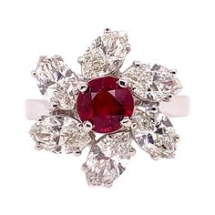 This stunning GIA certified heated ruby is the focal point in this mesmerizing custom setting in 18k white gold. The large marquis diamonds weighs 2.75 carats and surround the ruby like a pinwheel motif. The ruby is 1.14 carat and has a deep, vivid red hue. Ring Size: 6.5 & can be sized. Heart Diamond, Marquise Diamond, Ruby Ring, Diamond Heart, Cocktail Rings, Diamond Rings, Le Point, Floral Pattern, Ruby