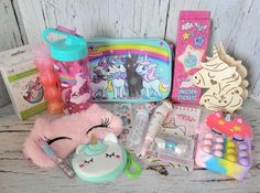 🎉🦄 Surprise your unicorn lover on their special day with this Unicorn themed gift set. - purse - wallet - straw cup - slime - stickers - night light - pen & notebook - eraser - bubbles - temporary tattoos - eye mask - lip gloss - diamond art keychain - push pop bubble pouch Personal birthday messages may be added to notes and will be applied to a gift tag. Slime Stickers, Art Keychain, Push Pop, Pop Bubble, Unicorn Stickers, Straw Cup, Unicorn Lover, Unicorn Gifts, Best Birthday Gifts