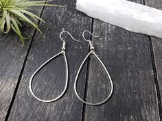 "These super lightweight teardrop hoop earrings feature 40mm x 26mm brass open teardrops. Choose silver-plated or gold-plated! These minimalist geometric earrings will complement any outfit, and are lightweight enough for all day wear! The earrings measure 2.5 inches from the bottom of the teardrop to the top of the ear wires. The gold earrings have hypoallergenic gold-plated surgical steel ear wires, while the silver earrings have hypoallergenic surgical steel ear wires. These earrings are incr Nickel-free Teardrop Earrings For Everyday Wear, Everyday Teardrop Nickel Free Earrings, Everyday Nickel-free Teardrop Earrings, Everyday Teardrop Earrings With Ear Wire, Minimalist Nickel-free Teardrop Earrings, Hypoallergenic Metal Teardrop Earrings For Everyday, Everyday Metal Teardrop Drop Earrings, Everyday Metal Teardrop Earrings, Everyday Teardrop Hoop Earrings