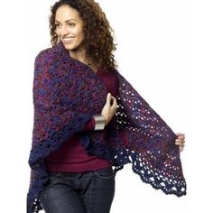 a woman wearing a purple and blue shawl