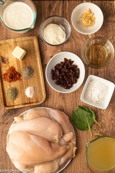 the ingredients for this dish are laid out on a wooden table