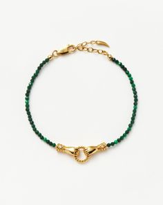 Harris Reed In Good Hands Mini Beaded Gemstone Bracelet | 18k Gold Plated/Malachite. Inspired by Our Harris Reed X Missoma Sell Out ‘In Good Hands’ Design, Now in a New Mini Size. The Beaded Bracelet Features Malachite – a Gemstone Known for Transformation – Faceted to Catch the Light. Two Georgian-Inspired Hands Come Together in the Mini Pendant. Intricately Detailed, Each Cuff Has Been Illuminated with White Cubic Zirconia and Features a Ring with a Black Enamel. Wear Solo for a More Minimalist Look or Layer with Beaded Styles for a Pop of Color. Metal: 18K Recycled Gold Plating on Brass Gemstone: Malachite & White Topaz Charm Dimensions: 8. 8mm X 26. 8mm S/M Length: 185mm with Continuous Extension from 160mm M/L Length: 215mm with Continuous Extension from 190mm Weight: 3. 9g Product Co Beaded Gemstone Bracelets, Harris Reed, Hands Design, Fortnum Mason, Malachite Bracelet, Google Image Search, Slider Bracelet, Gold And Silver Bracelets, Bracelets Diy