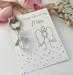 A beautiful handmade beaded sparkly crystal Angel charm on a silver stainless steel keychain, a perfect personalised  meaningful, birthday, thank you or any occasion gift for a Mother.  Option to choose a real crystal healing protection charm which will be wire wrapped by hand and added to the keychain. Choose from the drop down menu from  Rose Quartz -  Trust , Love , Healing Amethyst -  Protection,  Clarity,  Calmness  Green Aventurine -  Strength,  Confidence,  Courage Carnelian -  Confidence Silver Keychain With Lobster Clasp For Gift, Silver Keychain With Lobster Clasp As Gift, Personalized Silver Keychain Gift, Personalized Silver Keychain For Personal Use, White Keychain With Lobster Clasp For Gift, White Keychain With Lobster Clasp As Gift, Silver Keychain For Gift, Personalized Silver Keychain, Handmade Silver Keychain For Personal Use