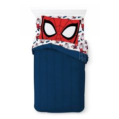 a spiderman bedding set with blue sheets