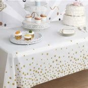 a table topped with lots of cakes and cupcakes