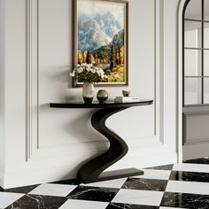 a black and white checkered floor with a painting on the wall next to it