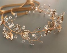 Celebrate with the beauty of nature by donning this delicate floral vine of luminous pearls, sparkling crystals and delicate stamped gold metal leaves. Daintily rimming your head, this hand wired hair vine is   perfect for your Boho, rustic or woodland garden wedding. MADE TO ORDER Please allow 2-3 weeks to complete your order DETAILS * Measures aprox. 1.75' wide (at widest part by 14" long. * Lightweight and flexible for easy shipping. *  Choice of ribbon colors * Offerend in gold View my compl Pearl Wedding Headband, Flower Head Wreaths, Pearl Headband Wedding, Floral Bridal Hair, Boho Headpiece, Flower Girl Accessories, Wedding Hair Wreath, Wedding Ready, Vintage Evening Bags