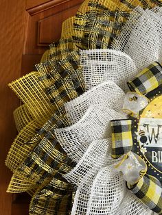 a yellow and black burlock wreath with the words welcome to buffalo on it