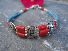 Nepal Ethnic Bracelet Turquoise Coral Tibetan Silver Bracelet Traditional Blue Red Silver Bracelet Tribal Gipsy Boho Bracelet. One more beautiful piece from Nepal. This bracelet is made with turquoise, coral and silver beads in three strings. Its length is 7,5 inches and its width 0,4 of inch. For more handmade jewelry please visit : https://www.etsy.com/shop/AnnaRecycle?ref=hdr_shop_menu * I ship every order by registered mail with a tracking number, that you could check every moment by opening Adjustable Turquoise Bracelets For Festivals, Southwestern Adjustable Jewelry For Festivals, Adjustable Red Southwestern Bracelets, Southwestern Style Adjustable Red Bracelets, Southwestern Style Red Beaded Bracelets For Gift, Southwestern Style Red Beaded Bracelet As Gift, Antique Turquoise Jewelry, Antique Turquoise, Boho Bracelet