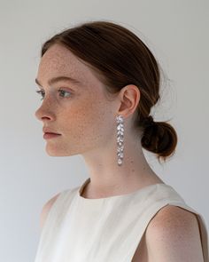 Make a statement with these stunning crystal dangle earrings, featuring cascading marquise and teardrop stones for a touch of refined elegance. Lightweight and versatile, they add just the right amount of sparkle, perfect for brides who want a timeless yet glamorous accessory on their big day. Wedding Earrings Bride, Statement Wedding Earrings, Statement Earrings Wedding, Bride Earrings, Crystal Dangle Earrings, Earrings Large, Glam Wedding, Crystal Drop Earrings, Large Earrings