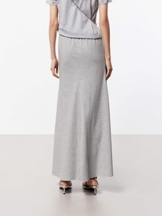 MO&Co. Women's Elasticated Waist Maxi Skirt This flowing maxi skirt is crafted from a soft and breathable cotton blend fabric, making it perfect for warm weather wear. It has a high-waisted design that sits comfortably at the natural waistline, while the A-line silhouette creates a flattering, feminine shape that gently flares out towards the hem. An elasticated waistband ensures a comfortable and flexible fit. Pair this skirt with a tucked-in T-shirt for a chic and put-together look. Features : Weather Wear, Fabric Making, Gray Skirt, Warm Weather, Maxi Skirt, High Waist, A Line, Cotton Blend, High Waisted