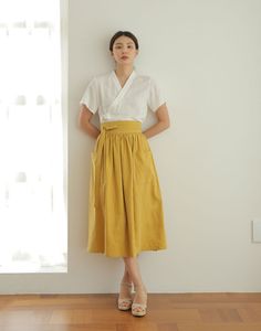 This skirt is a waist skirt with large pockets on both sides.   * 3colors - Mustard & Navyblue & Khaki   * Wrap design waist skirt   * Beautiful Linen design fabric material   * Try match with any other item that you have, they will look great together!   ▶Size    - For the detailed size, please refer to the table in the side menu attached with the picture. ▶Materials  - For more information on the mixing ratio of textiles, please refer to the table in the side menu attached with the picture. ▶M Culotte Skirt, Linen Design, Modern Hanbok, Skirt High Waist, Womens Skirts, Korean Traditional, Skirt Vintage, Vintage Linen, Design Fabric