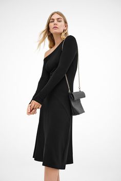 Our Angela Dress is a study in casual refinement. An eloquent extension of our Murray Top, Angela emerges as a midi silhouette with an off-shoulder neckline and long sleeves, marked by a diagonal seam that intersects her fitted top and a-line skirt. Fashioned from soft & sustainable European jersey, Angela only gets better with time.[SPLIT] Maritza, in black, is 5'9.5" (177 cm) tall, wearing size XS. Yada, in chestnut, is 5'9" (175 cm) tall, wearing size XS. Approximately 44" (112 cm), measured Elegant Long Sleeve Off Shoulder Dress For Fall, Chic Asymmetrical Off Shoulder Dress For Spring, Chic Asymmetrical Off Shoulder Spring Dress, Fall Evening Asymmetrical Midi Dress, Elegant Fall Midi Dress With Asymmetrical Neckline, Elegant Midi Dress With Asymmetrical Neckline For Fall, Chic Off-shoulder Midi Dress, Elegant One Shoulder Midi Dress For Fall, Chic Long Sleeve Off Shoulder Dress For Cocktail