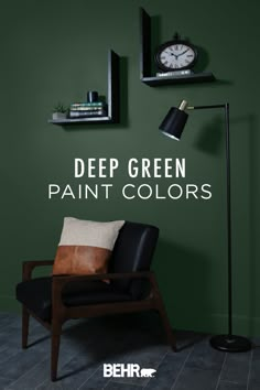 a black chair sitting in front of a green wall with the words deep green paint colors