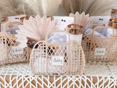 small baskets filled with personalized items on top of a table