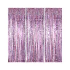 three pink curtains with fringes hanging from them