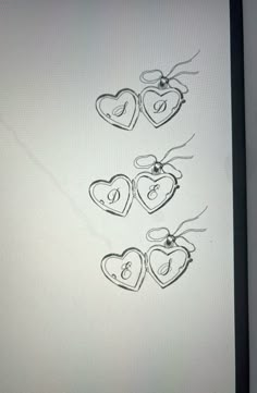 three hearts are drawn on a computer screen